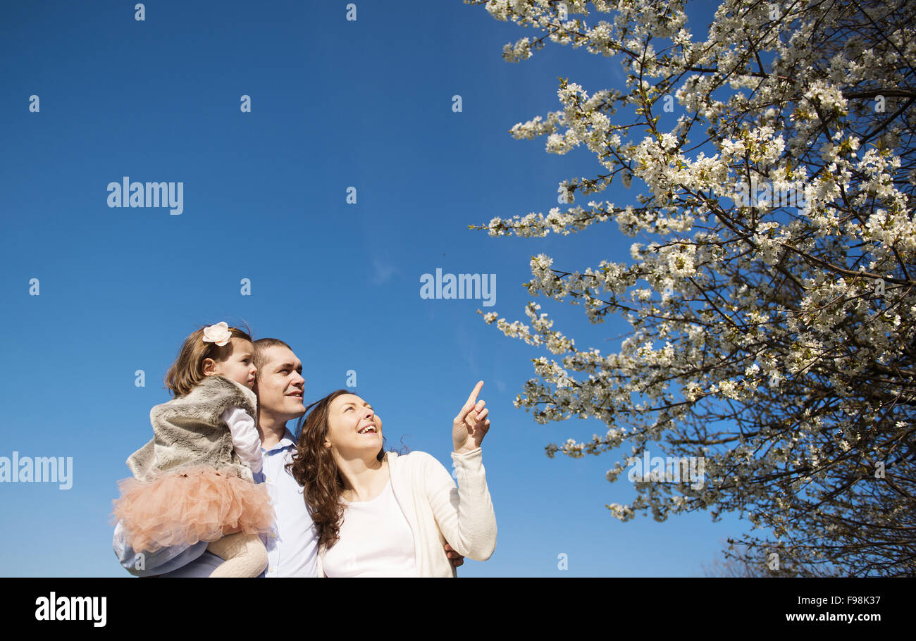 Happy pregnant family having fun in spring nature Stock Photo - Alamy