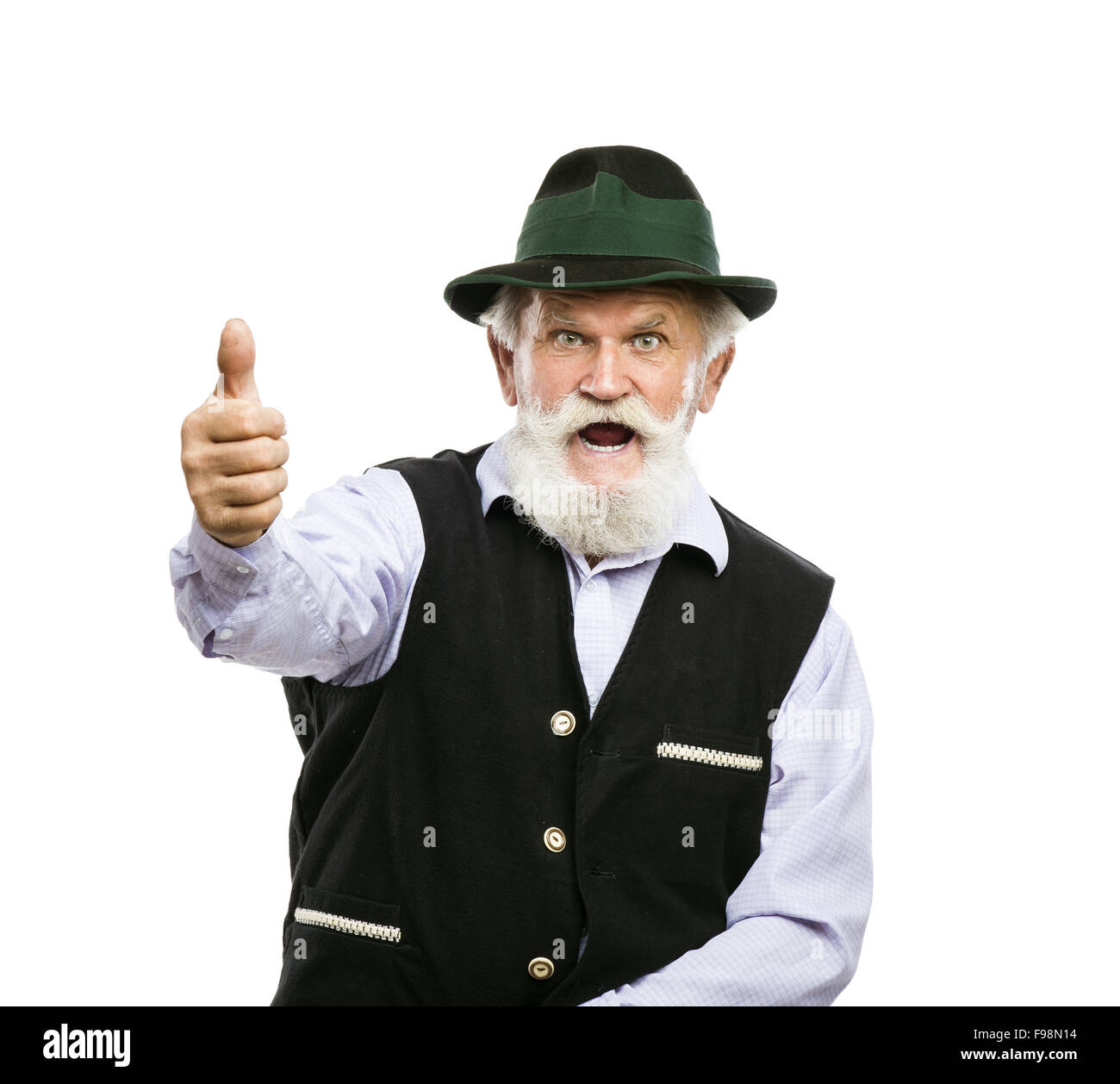 Portrait of old bearded bavarian man in traditional hat with thumbs up isolated on white background Stock Photo