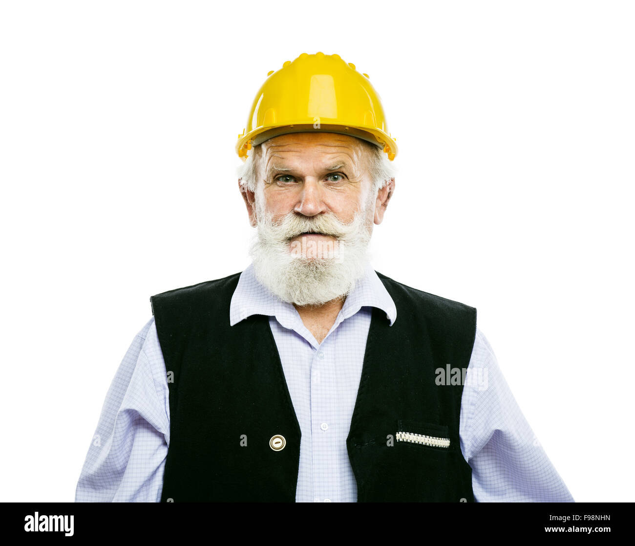 Senior manual worker with yellow helmet isolated over white background Stock Photo