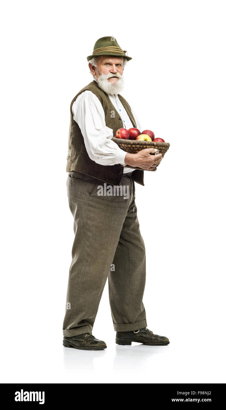 Old bearded farmer man in hat holding basket full of apples, isolated ...