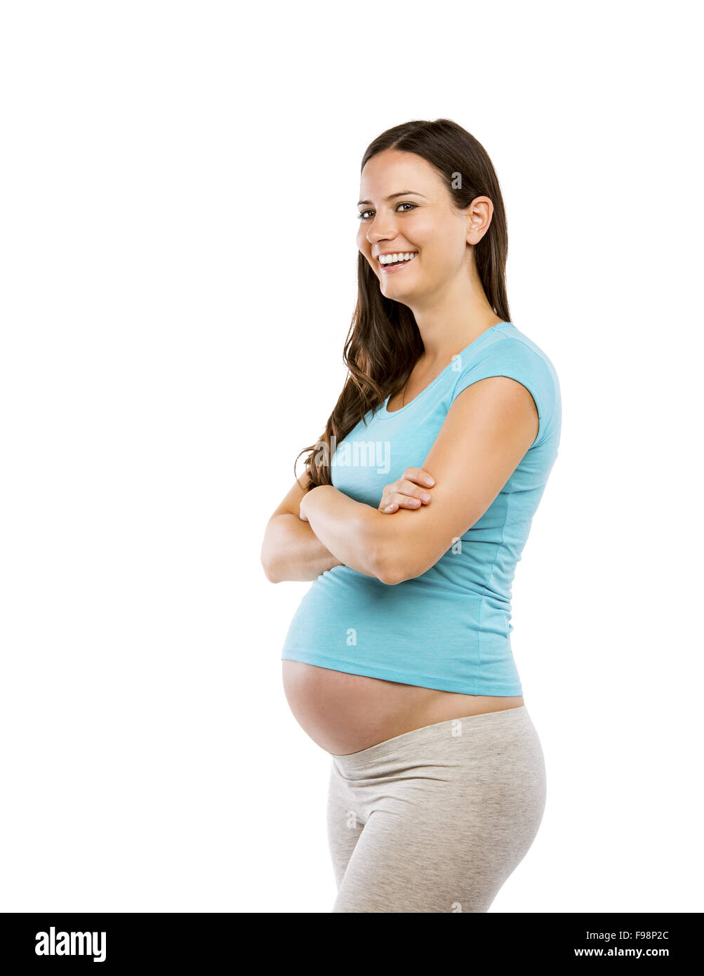 Studio portrait of a beautiful young pregnant woman isolated on white background Stock Photo