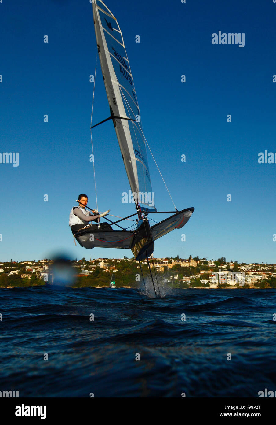 Scott Babbage in a training session on his Moth Mach 2 in Sydney Harbour, Single-handed sailing dinghy with hydro-foils. Stock Photo