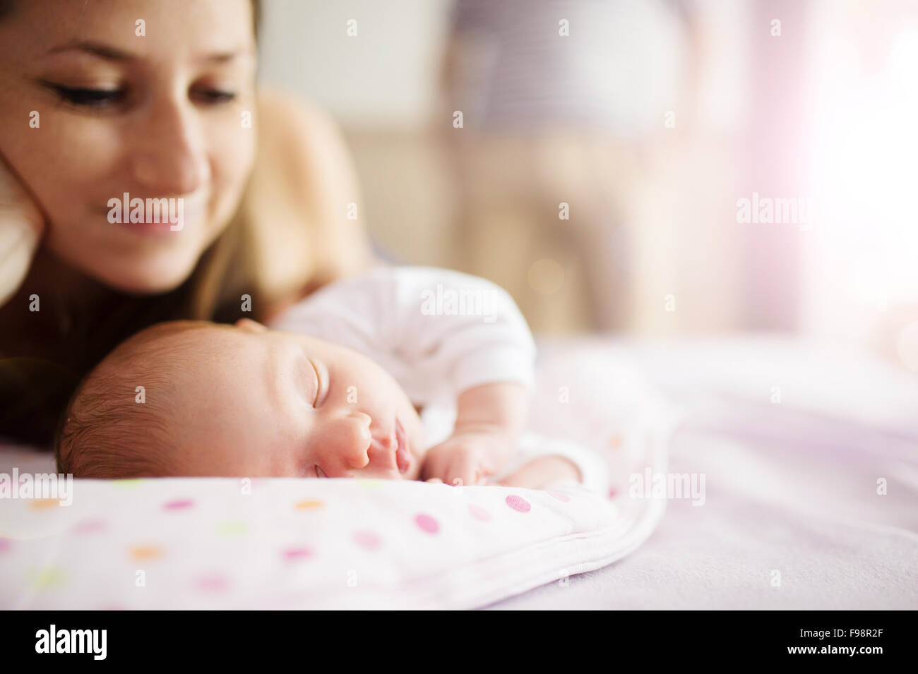 Happy mother with baby girl inside of room. Stock Photo