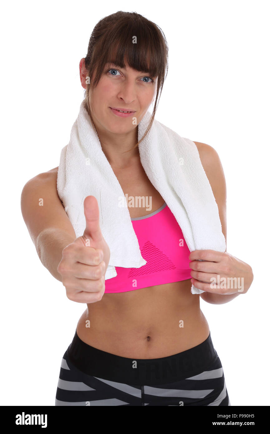 Young fitness sports woman with towel showing thumbs up isolated on a ...