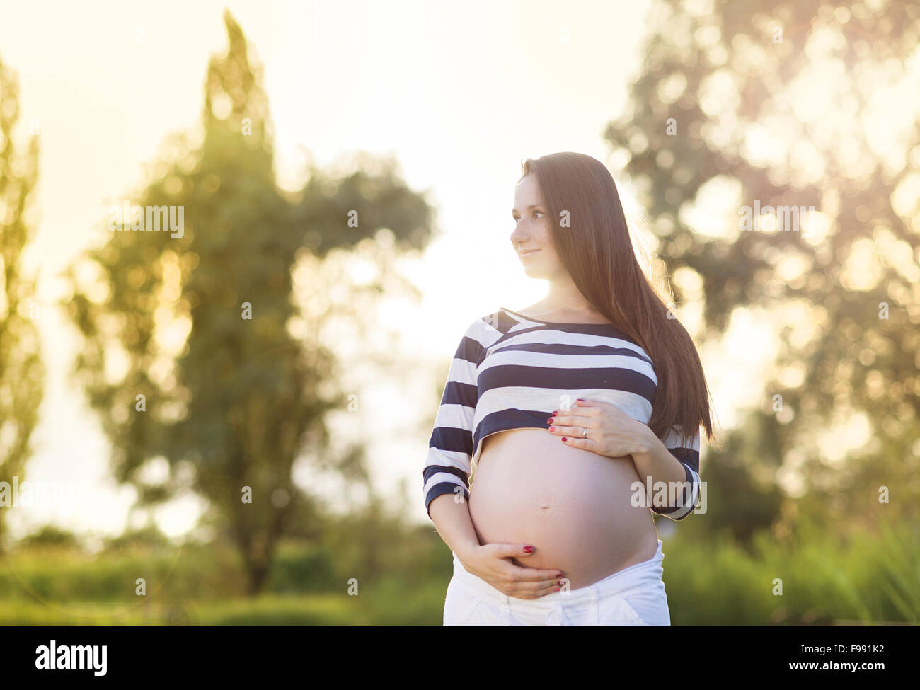 Woman holding abdomen hires stock photography