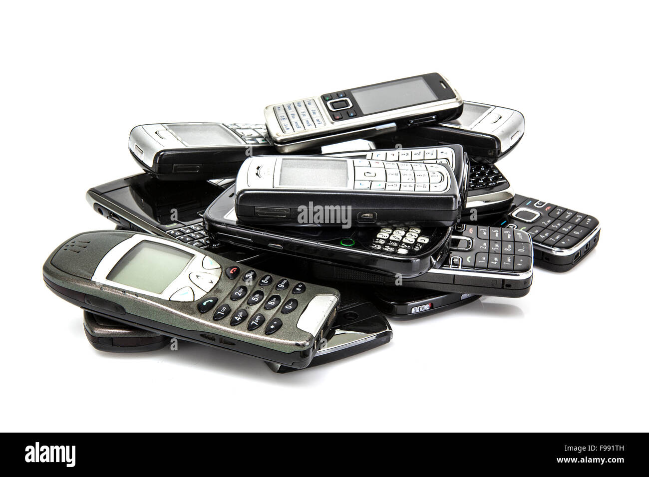 Pile of old mobile phones ready for recycling Stock Photo