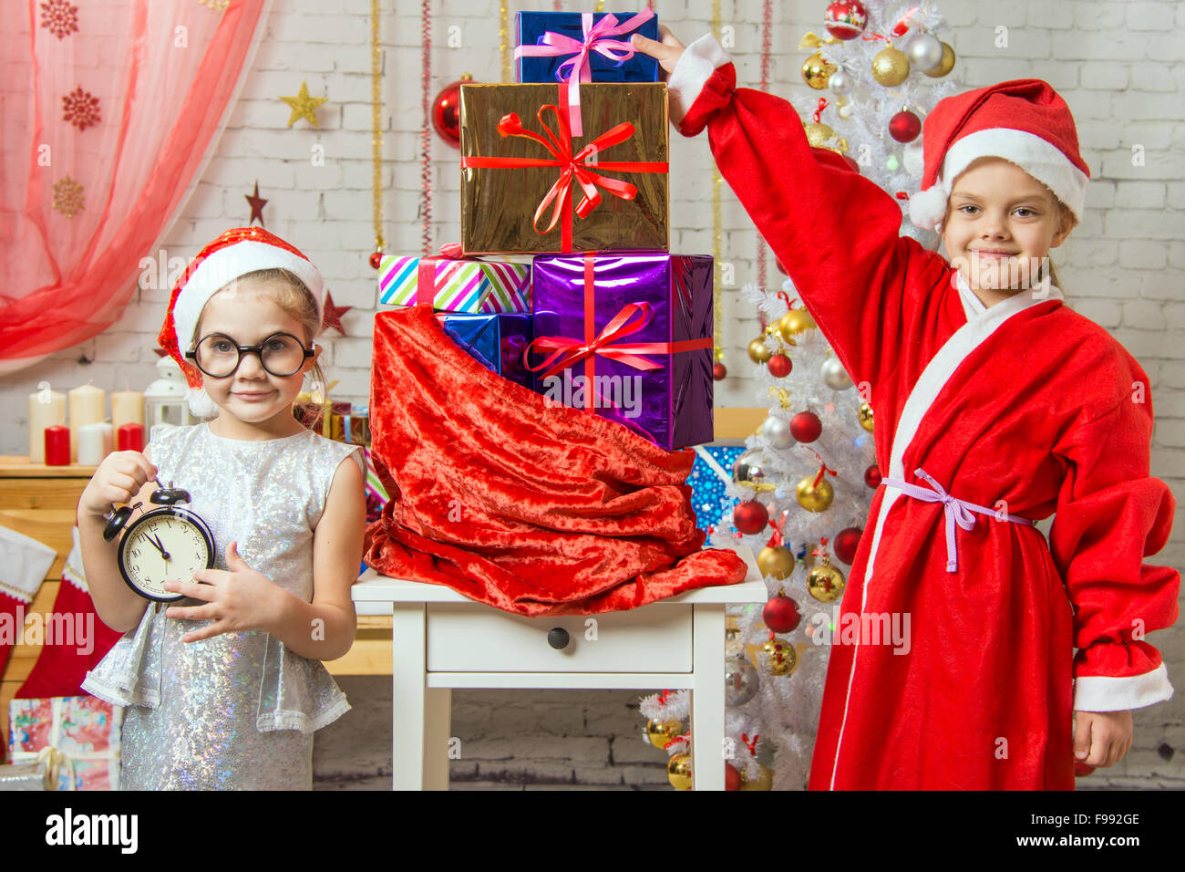 Two girls sisters four and six years in the New Year costumes are at ...