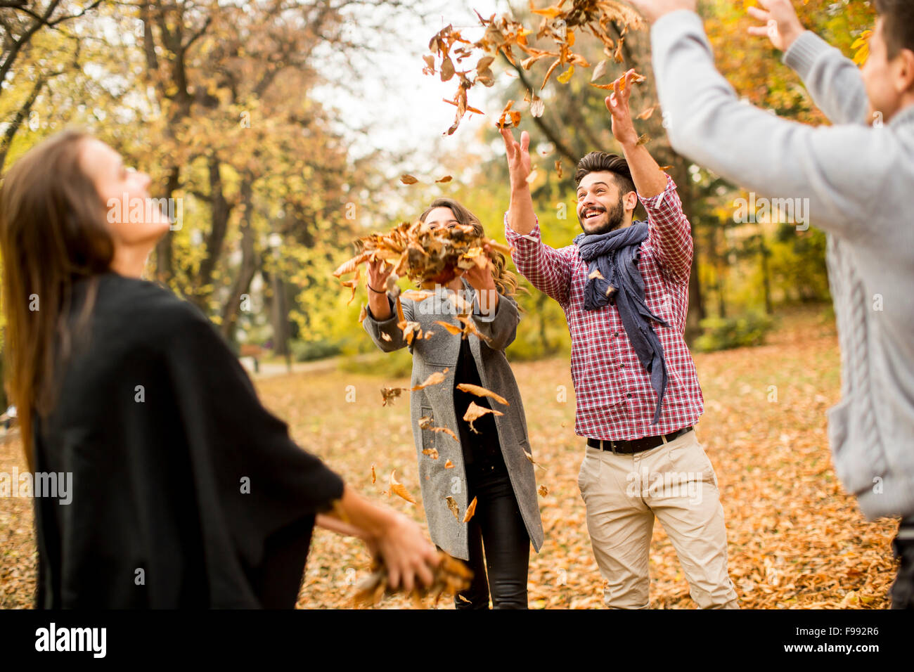 Have Fun Fall!!!!! Young people having fun in the autumn park Stock Photo - Alamy