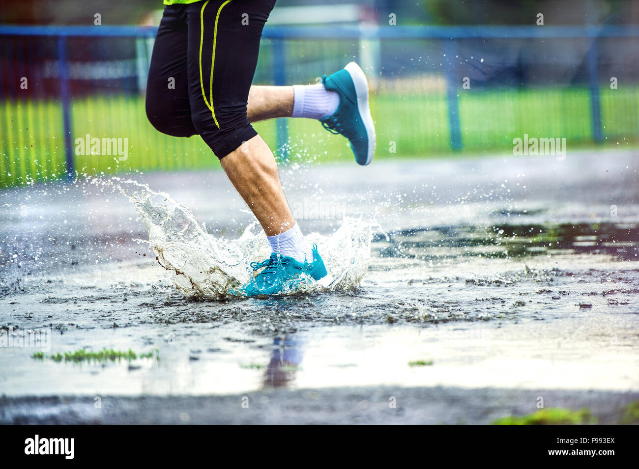 Young man running in rain hires stock photography and images Alamy