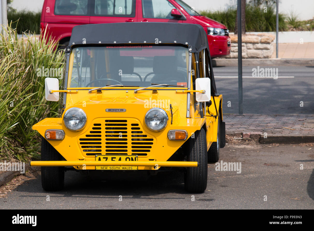 Yellow Mini Moke motor car vehicle parked in North Sydney, NSW, Australia Stock Photo