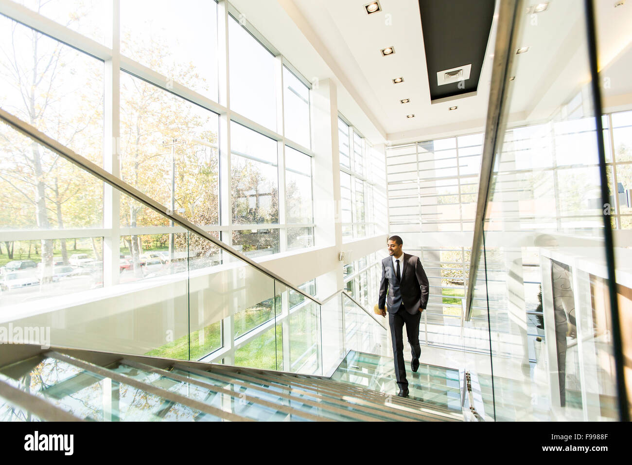 Young black african man walking hi-res stock photography and images - Alamy