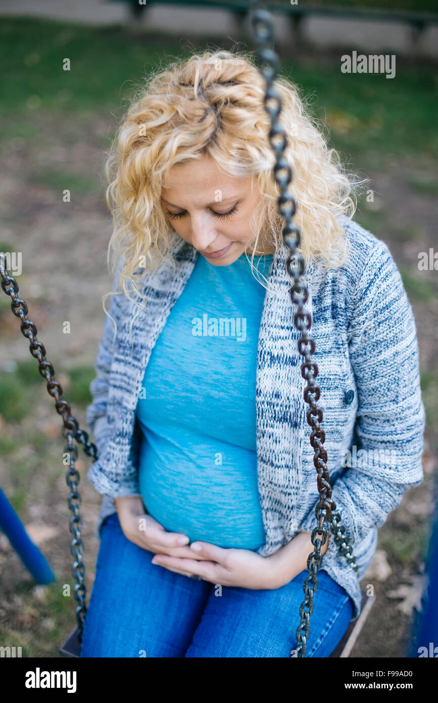 Pregnant woman on the swing Stock Photo Alamy