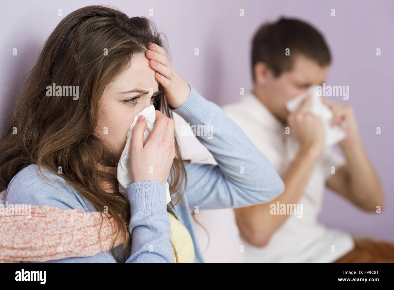 Sick woman and man have cold, flu and high fever. Stock Photo