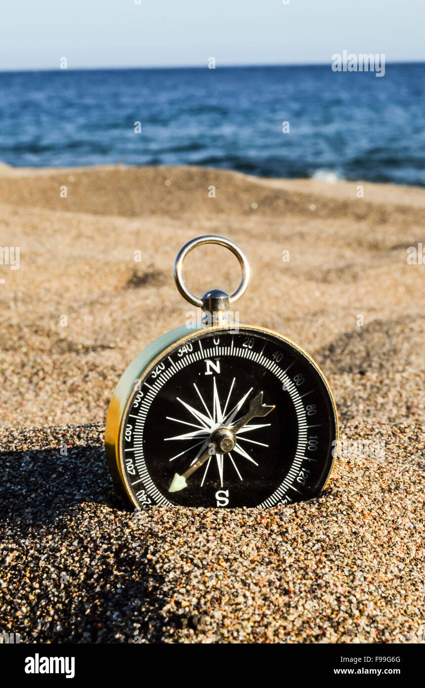 Compass on the Sand Beach Stock Photo - Alamy