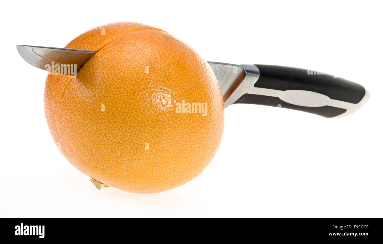 Grapefruit with knife Stock Photo Alamy
