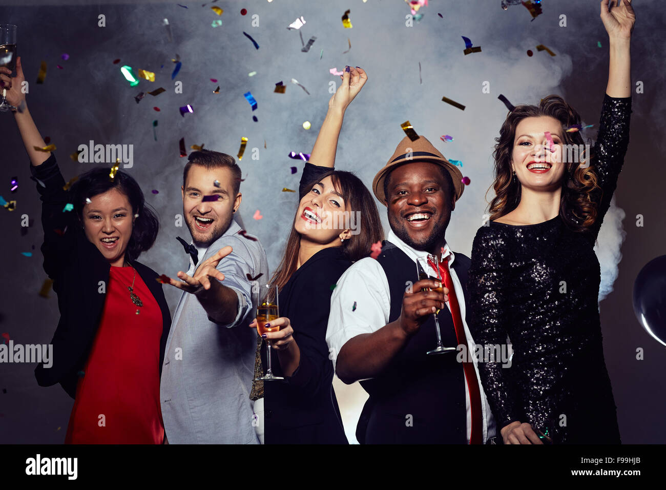 Joyful young people with champagne having party Stock Photo