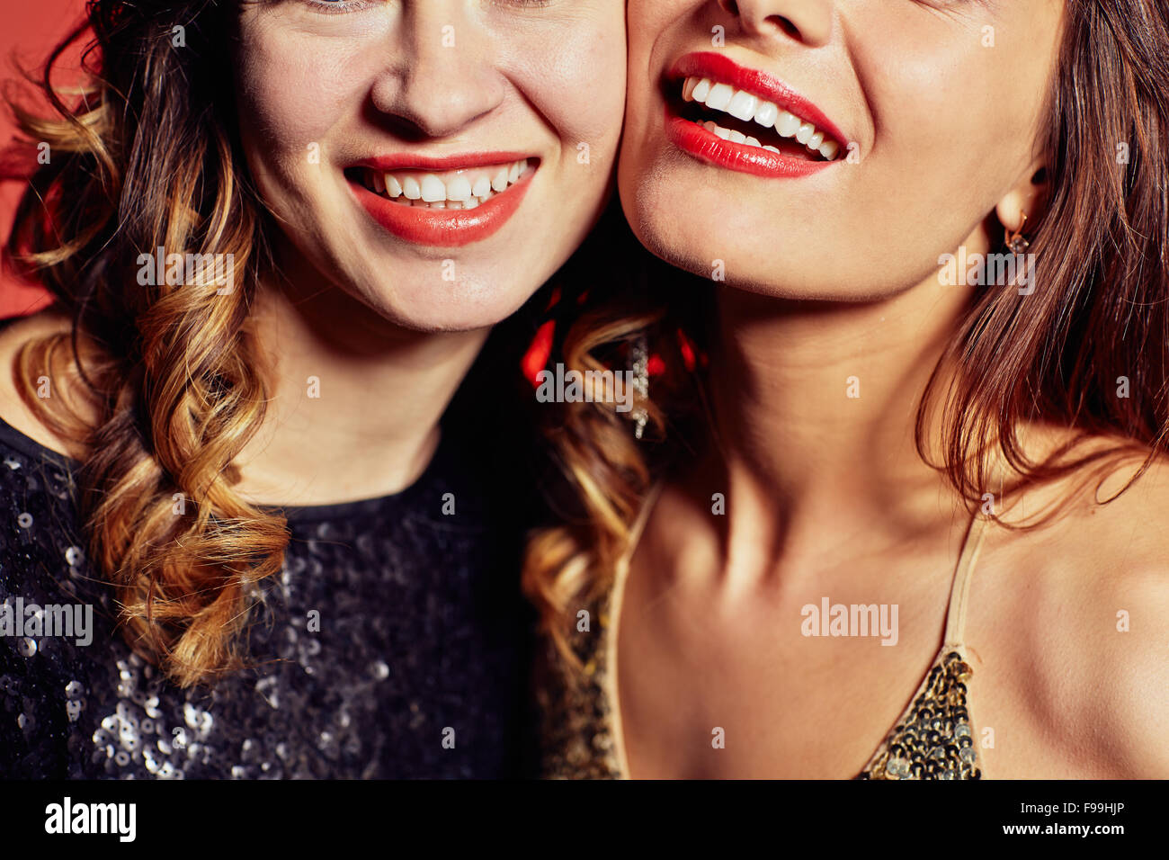 Happy young women with toothy smiles Stock Photo