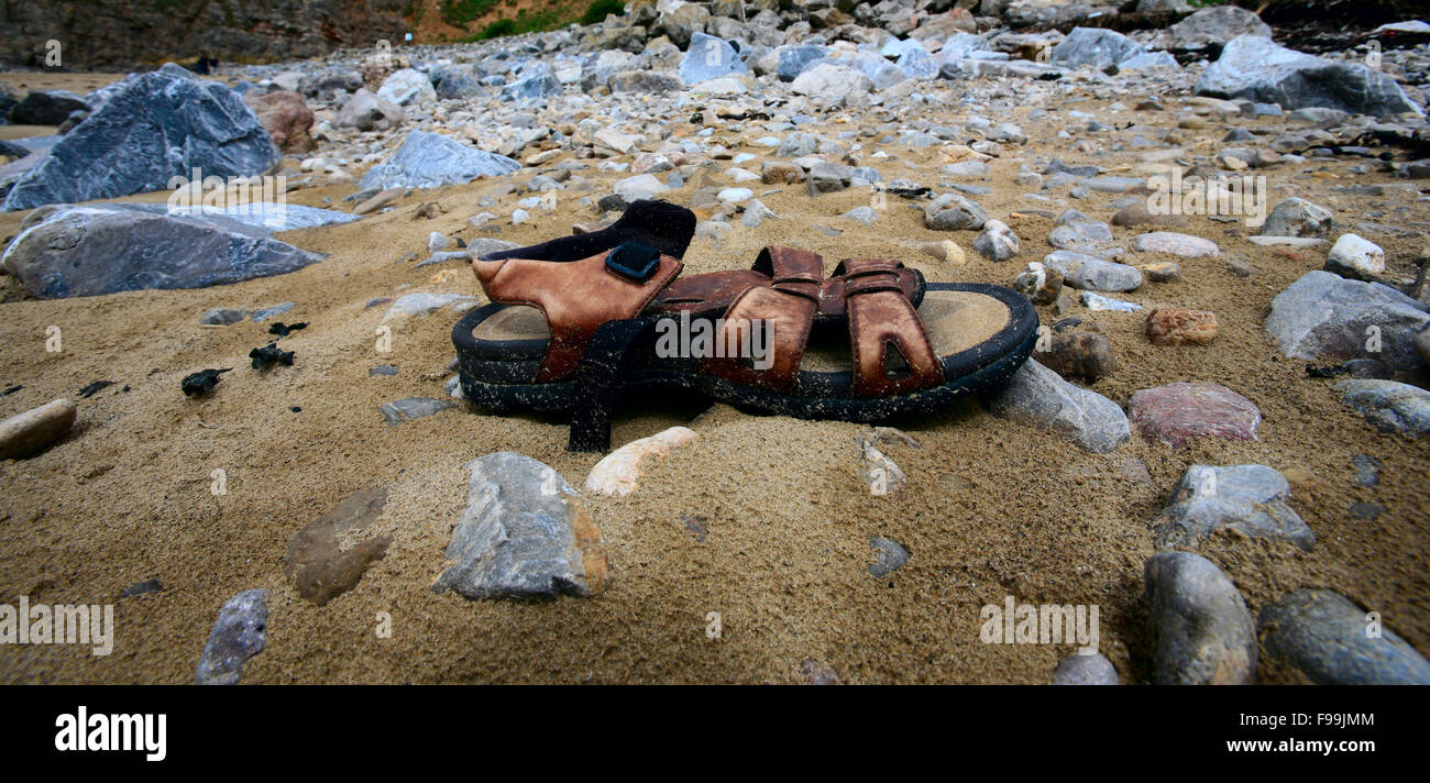 Washed up Sandal on beach Stock Photo