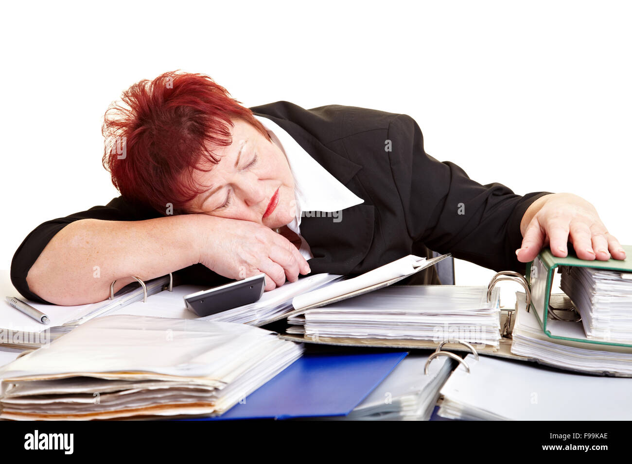 Tired female senior sleeping on files at her desk Stock Photo - Alamy