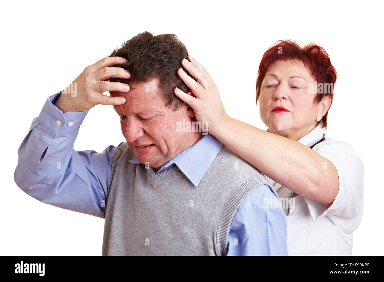 Man with migraine seeing a doctor for an examination Stock Photo