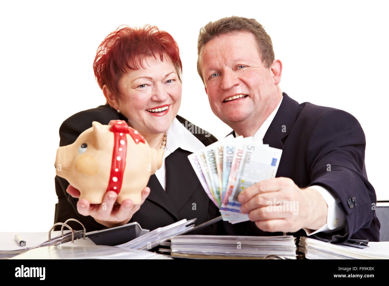Two happy seniors offering Euro money and piggy bank Stock Photo - Alamy