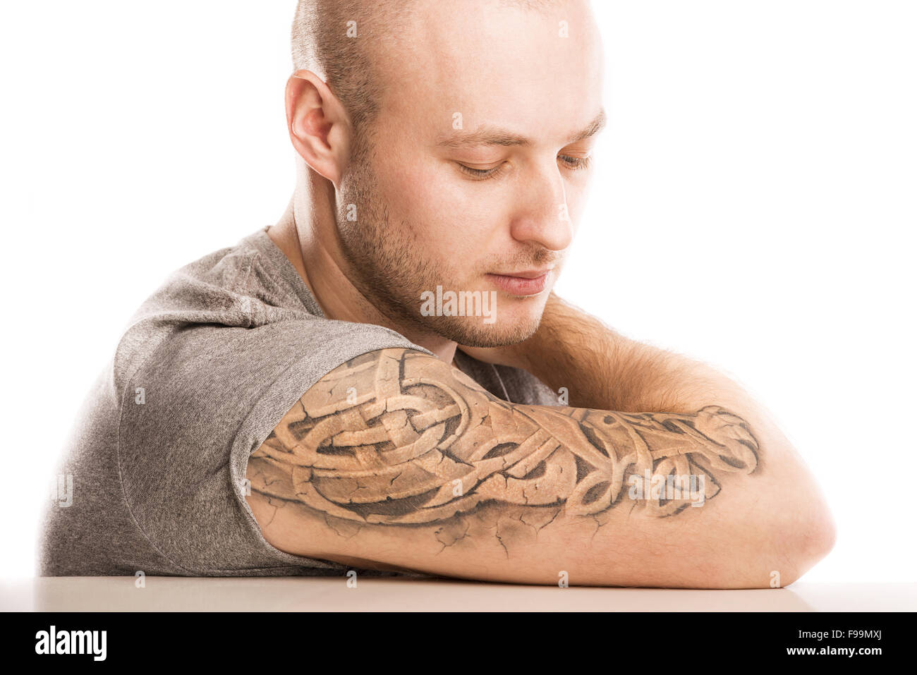 Handsome young man with tattoo, isolated on white. Stock Photo