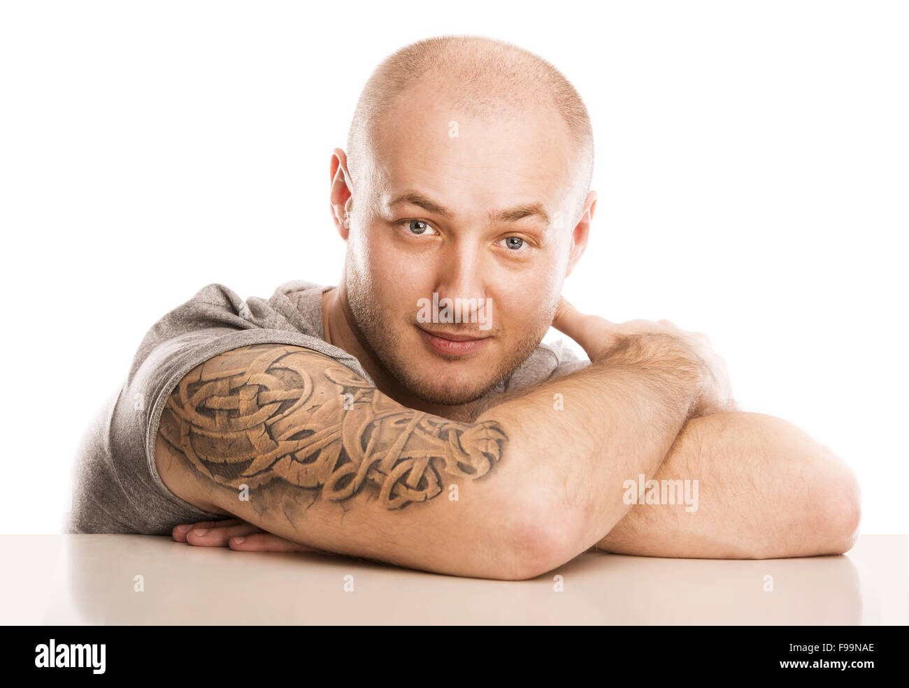 Handsome young man with tattoo, isolated on white. Stock Photo