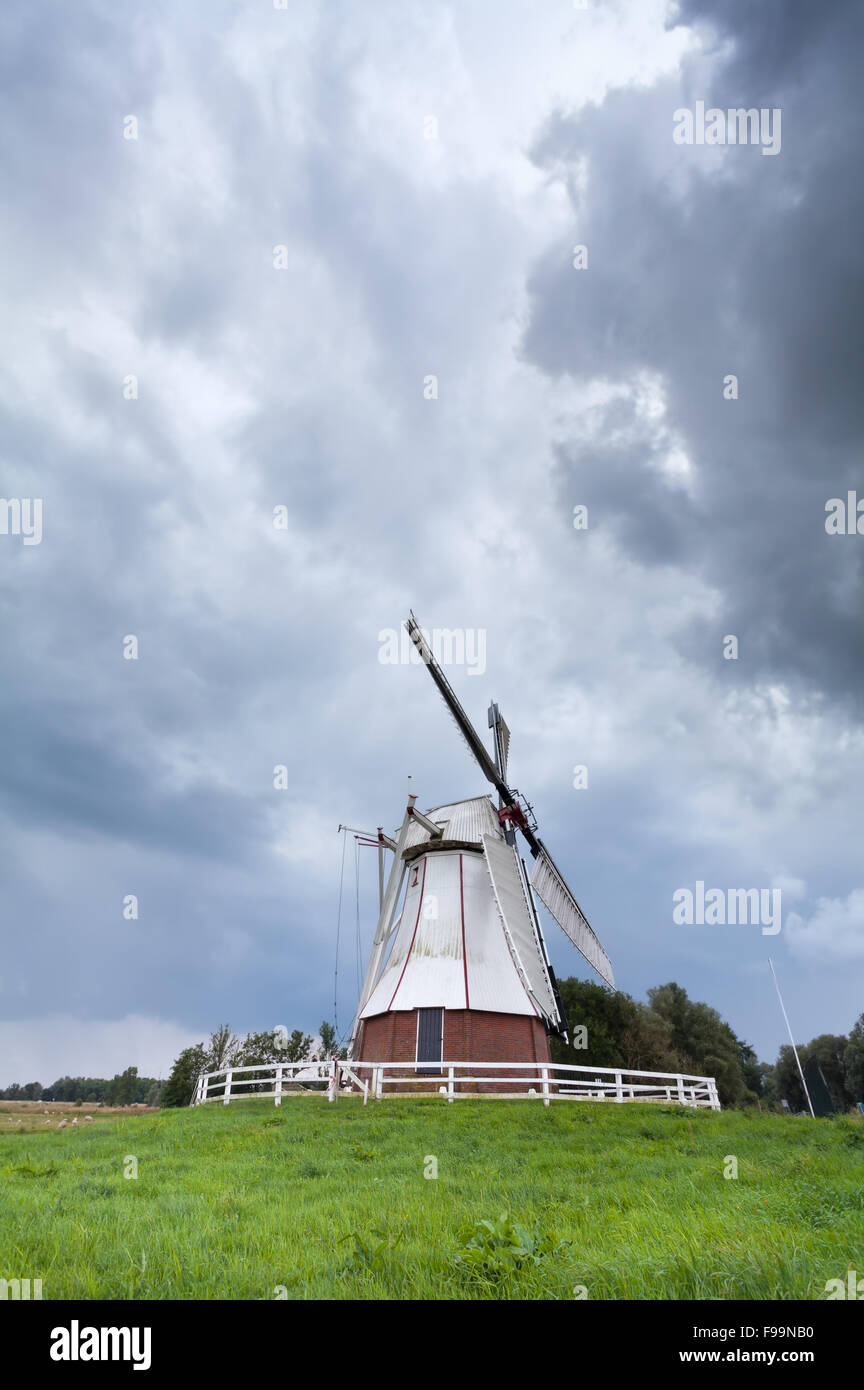 white windmill and stormy sky, Netherlands Stock Photo Alamy