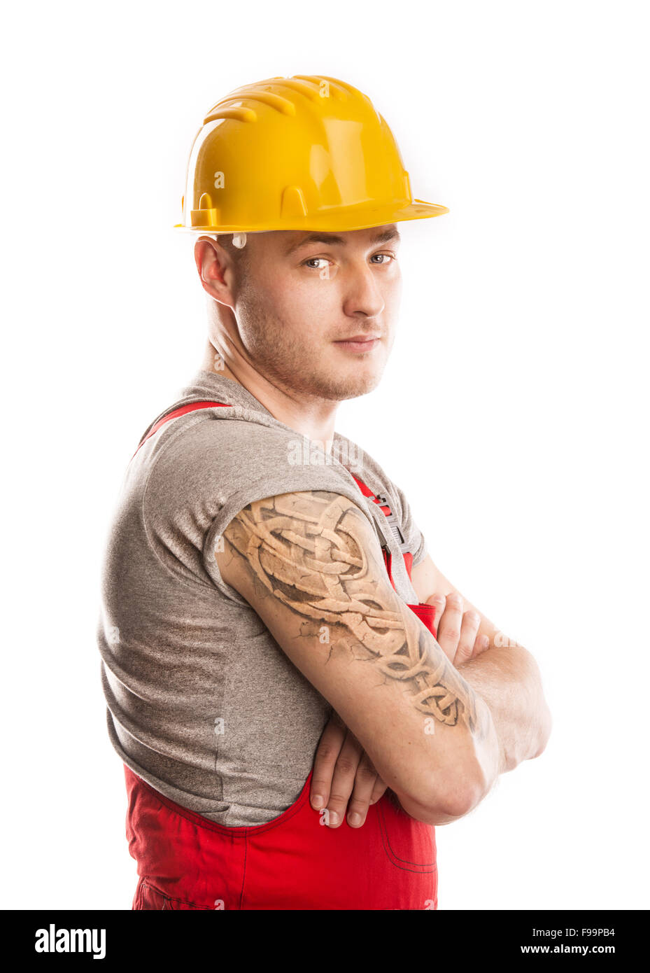 Construction worker in a protective helmet isolated over white background Stock Photo