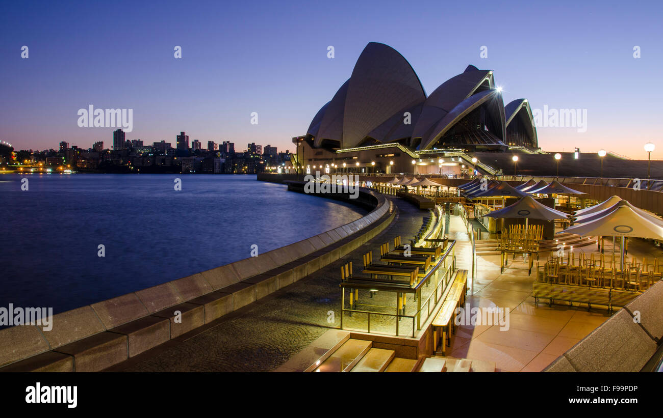 A pre-dawn, early morning shot of the Sydney Opera House with the lights on, just before sunrise in Australia Stock Photo