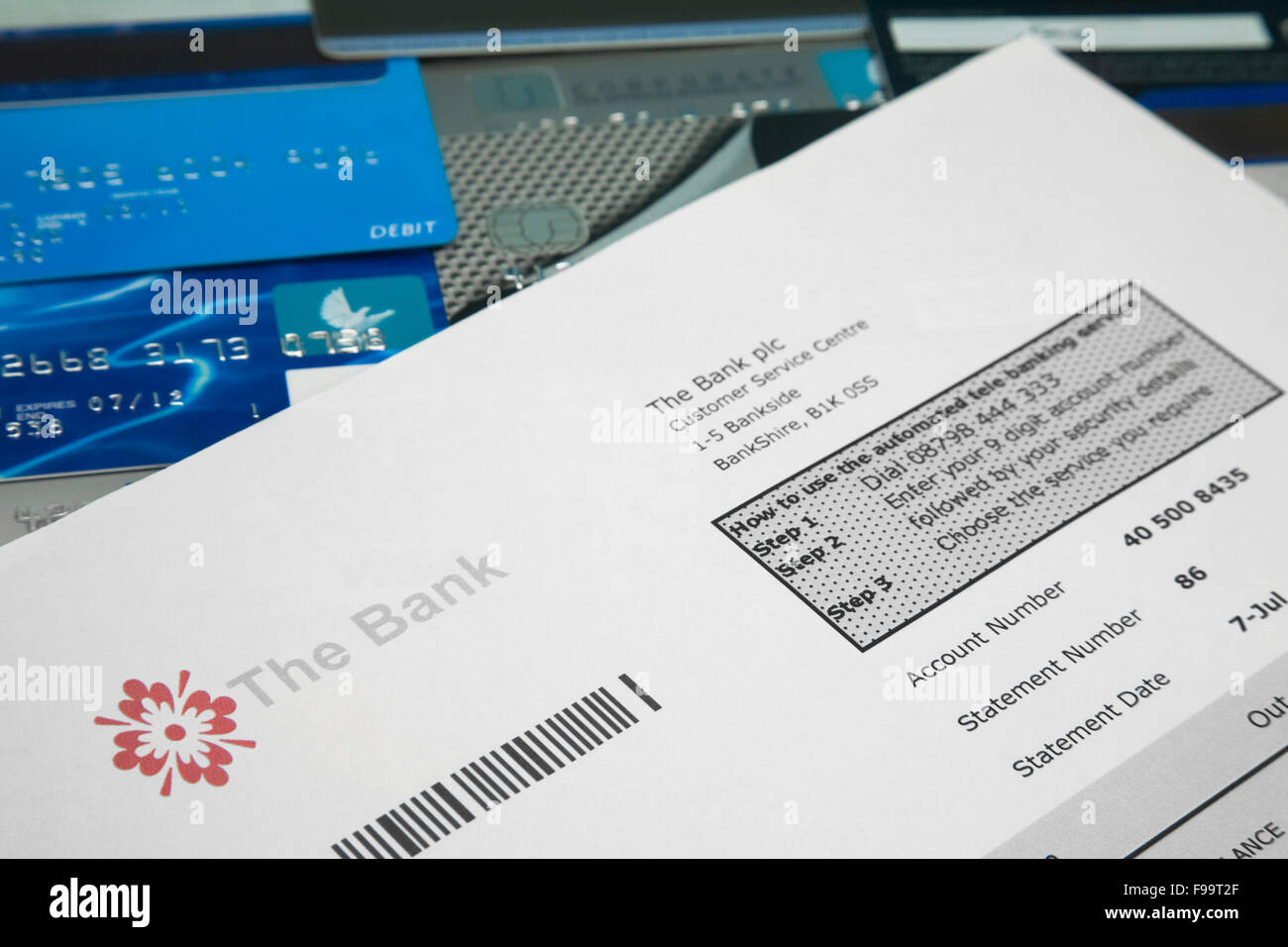 Fake bank statement on top of a selection on bank and credit car Stock