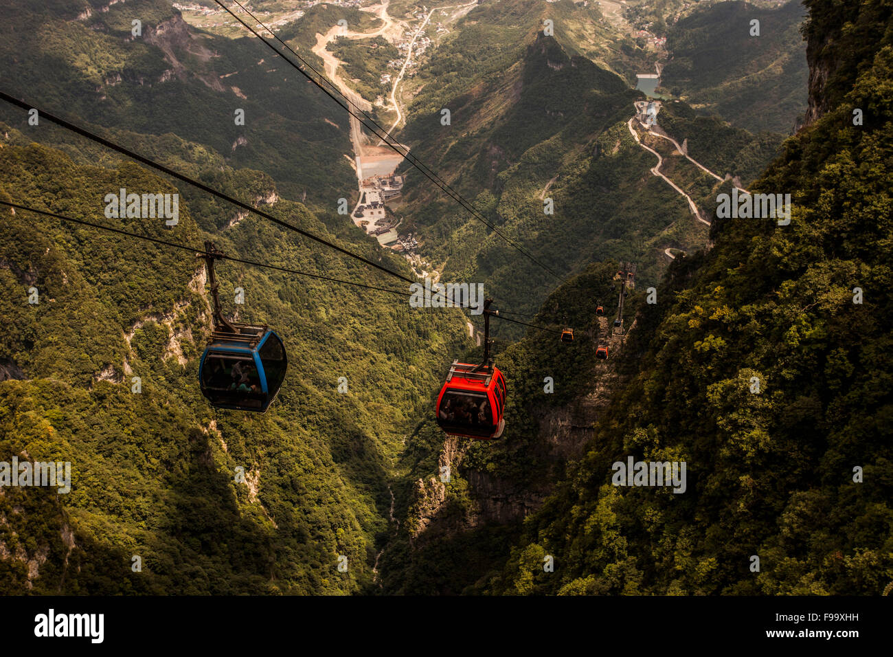 Cable car going up a mountain Stock Photo