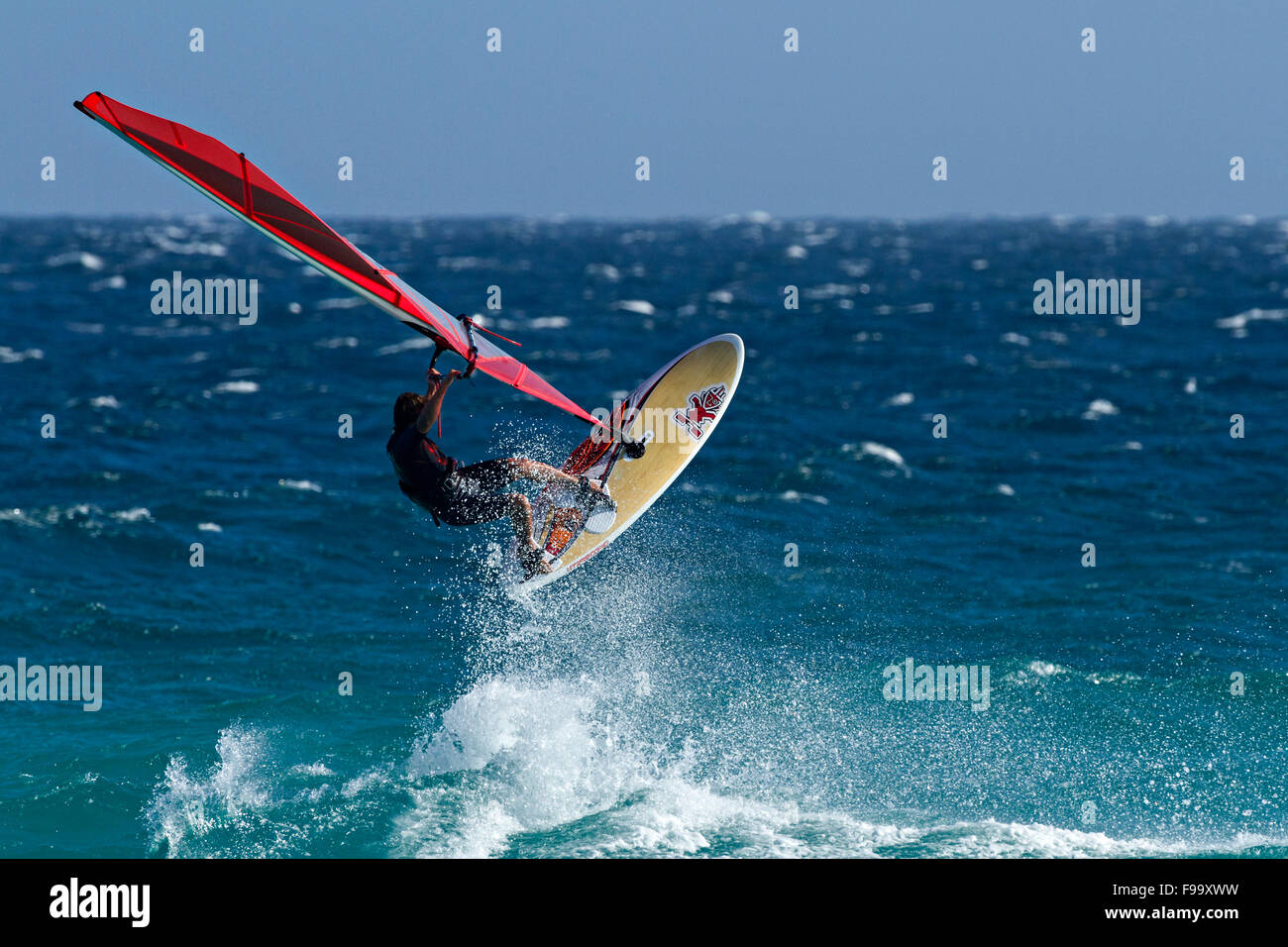 Wind Surfer wave jumping, Esperance, Western Australia. Stock Photo