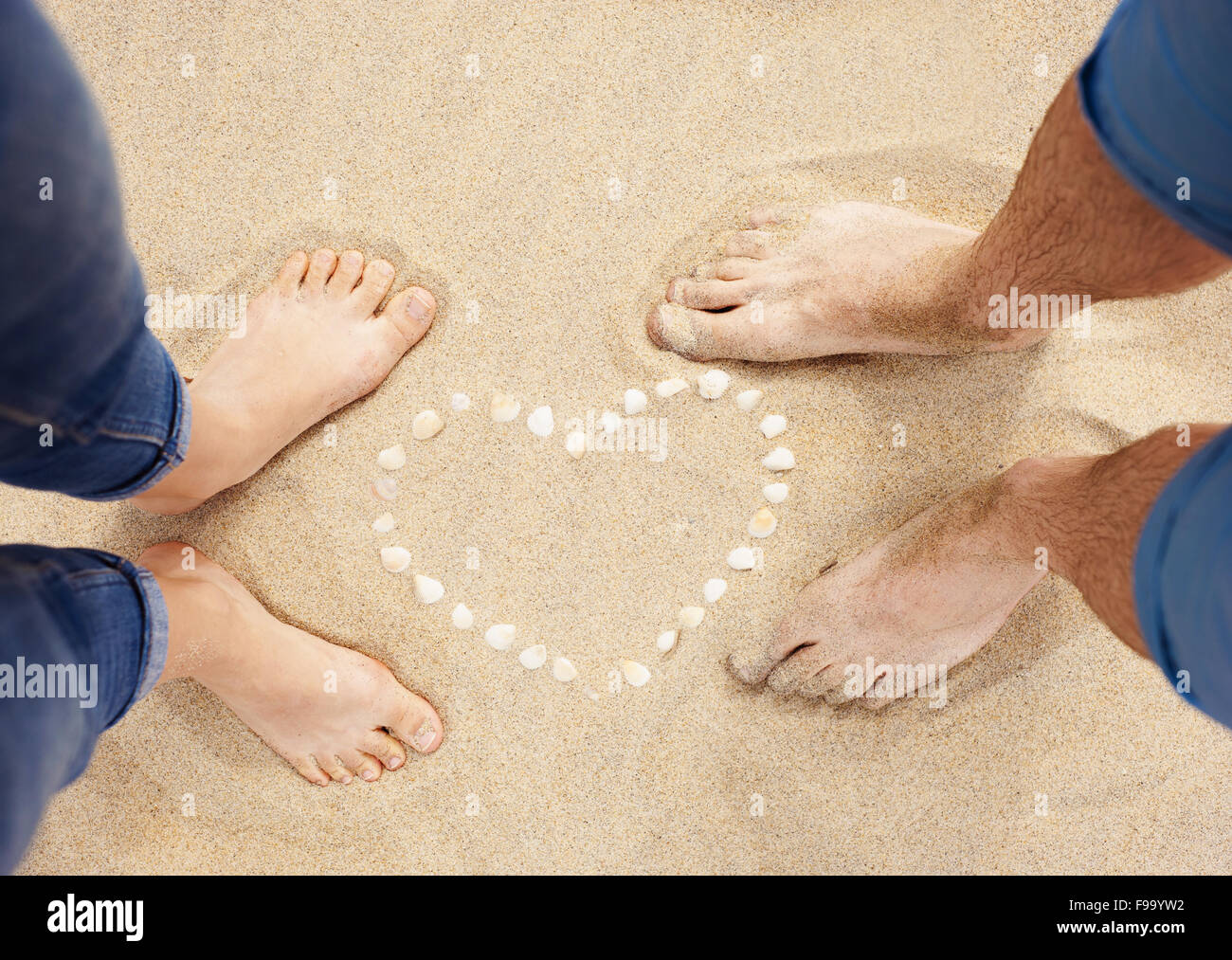 Female And Male Feet Closeup Of Woman And Man Standing Next To The S Heart At The Sandy Beach Female And Male Feet Closeup Of Woman And Man Standing Next To The S Heart At The Sandy Beach