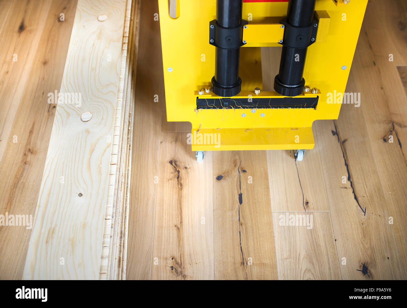 Close up of gluing machine for gluing wooden floor Stock Photo