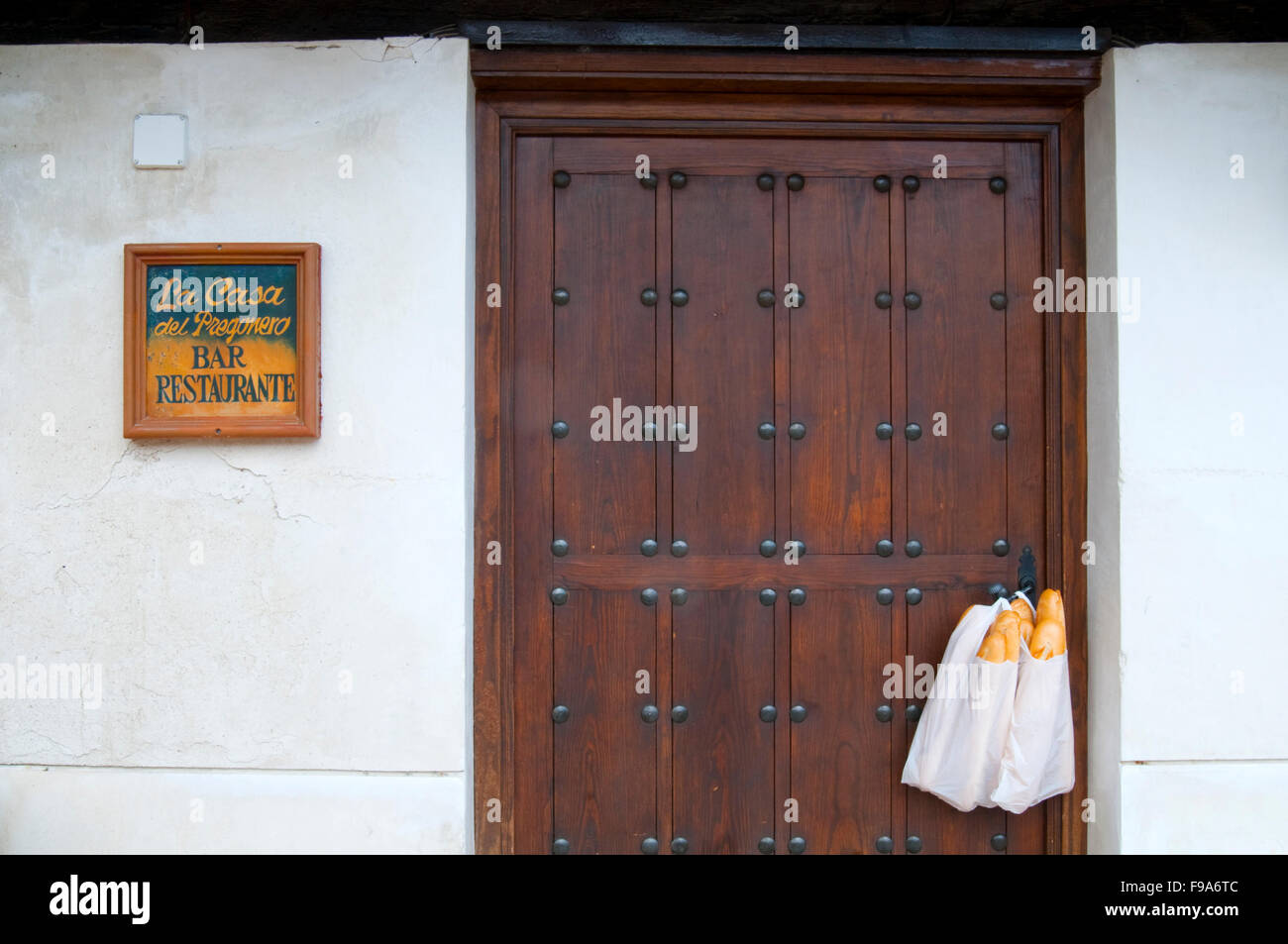Facade of restaurant and bag with bread. Chinchon, Madrid province, Spain. Stock Photo