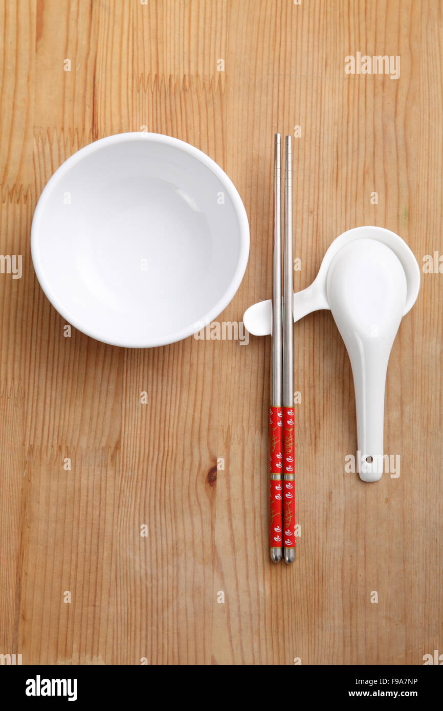 empty chinese rice bowl with spoon and chopsticks Stock Photo Alamy