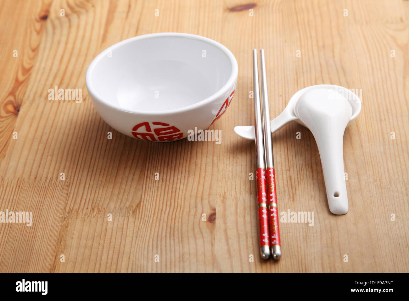 empty chinese rice bowl with spoon and chopsticks Stock Photo Alamy