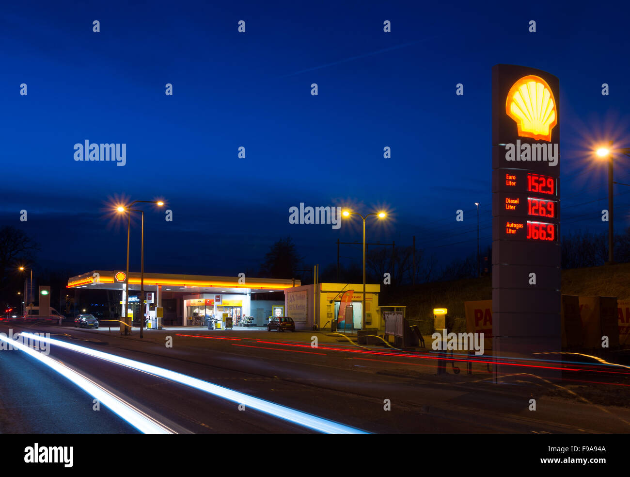 ENSCHEDE, NETHERLANDS - FEBRUARY 28, 2015: Shell gas station at night. Royal Dutch Shell, a dutch-british multinational, is the Stock Photo