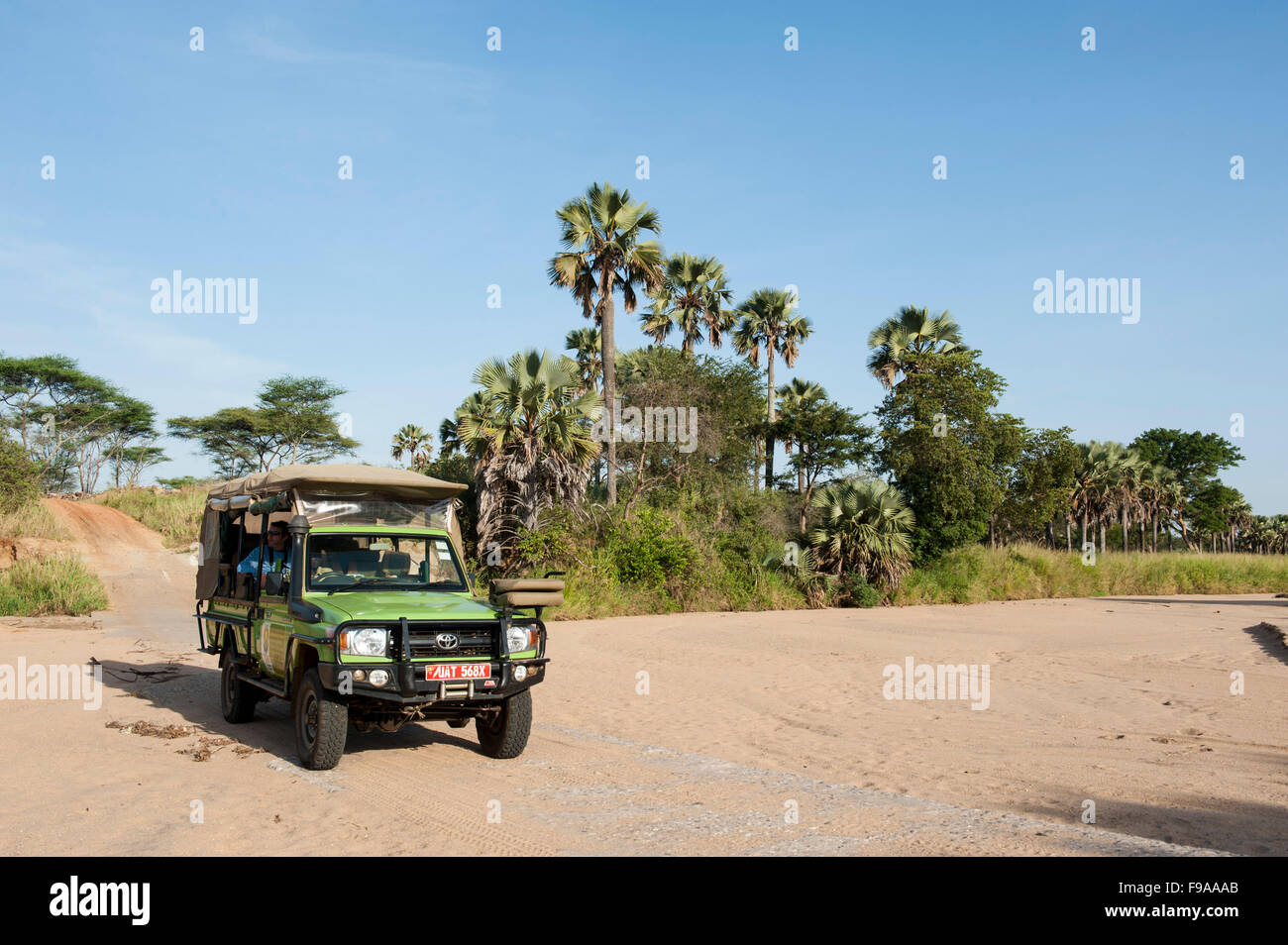 Safari vehicle crossing the Kidepo riverbed, Kidepo Valley National Park, Uganda Stock Photo