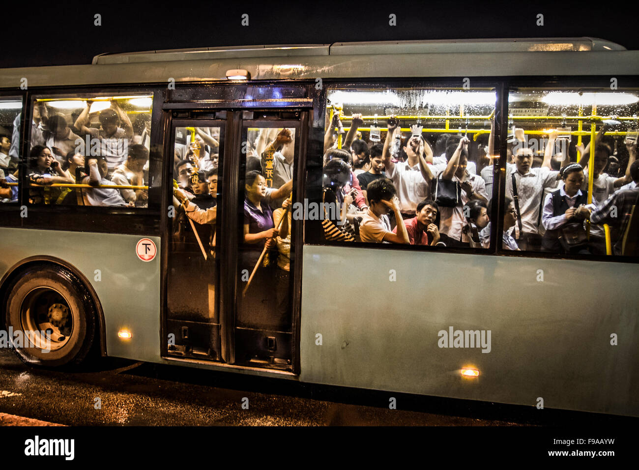 Overcrowded public bus Stock Photo