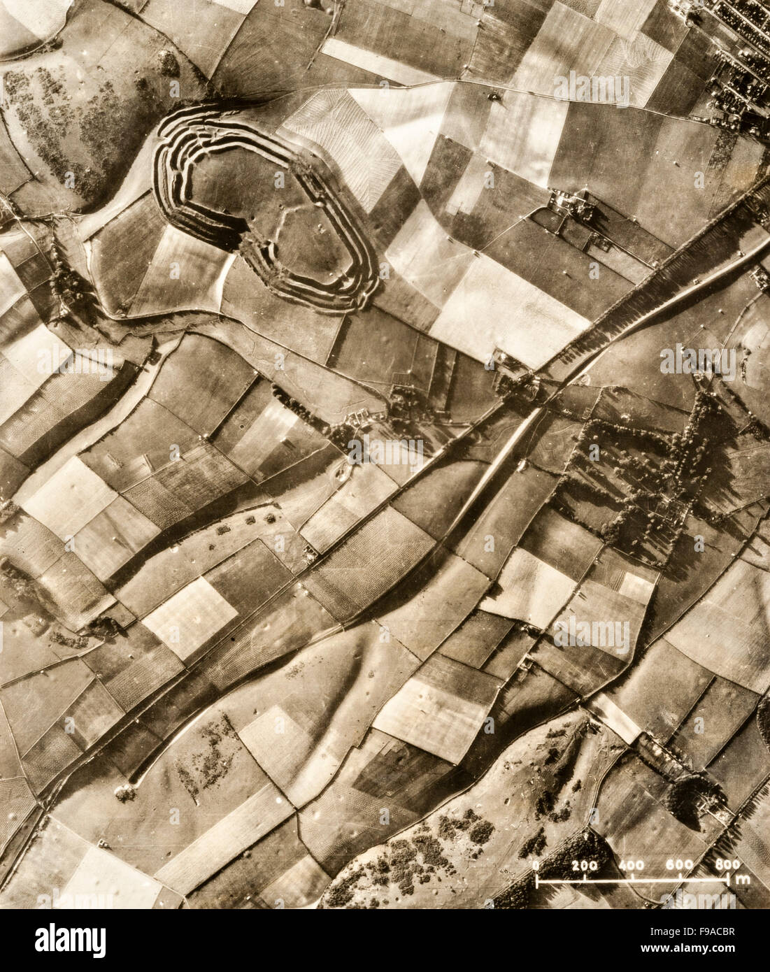 Maiden Castle, near Dorchester, Dorset, UK. A prewar aerial photograph of this Iron Age hill fort, taken during the 1930s. It is the largest hill fort in Britain. Construction began about 600 BC, with a major expansion around 450 BC Stock Photo