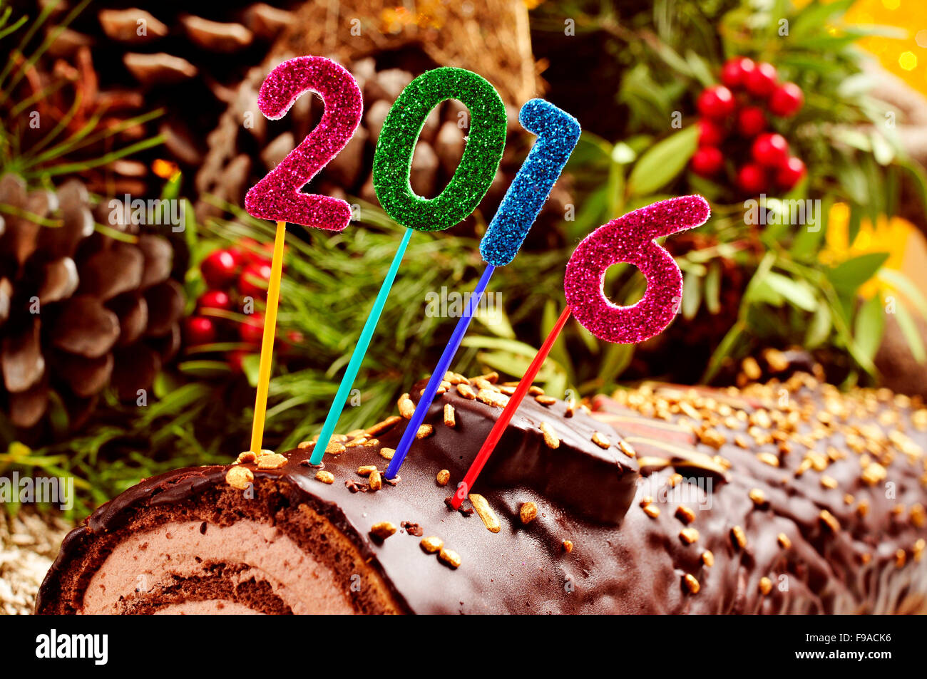 a yule log cake, traditional of christmas time, topped with glittering