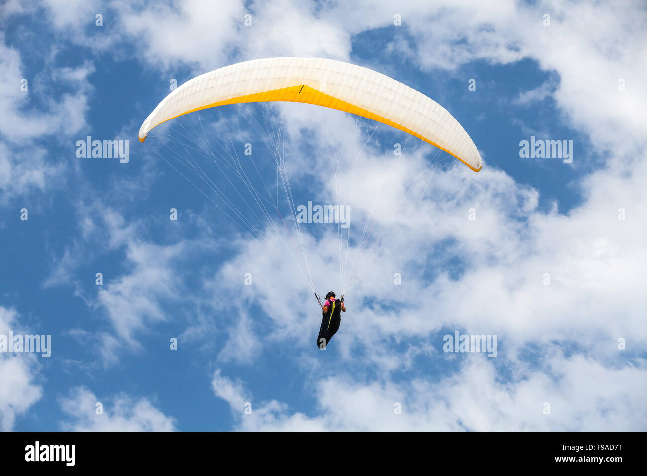 Burgas, Bulgaria - July 23, 2014: Amateur paraglider in blue cloudy sky Stock Photo