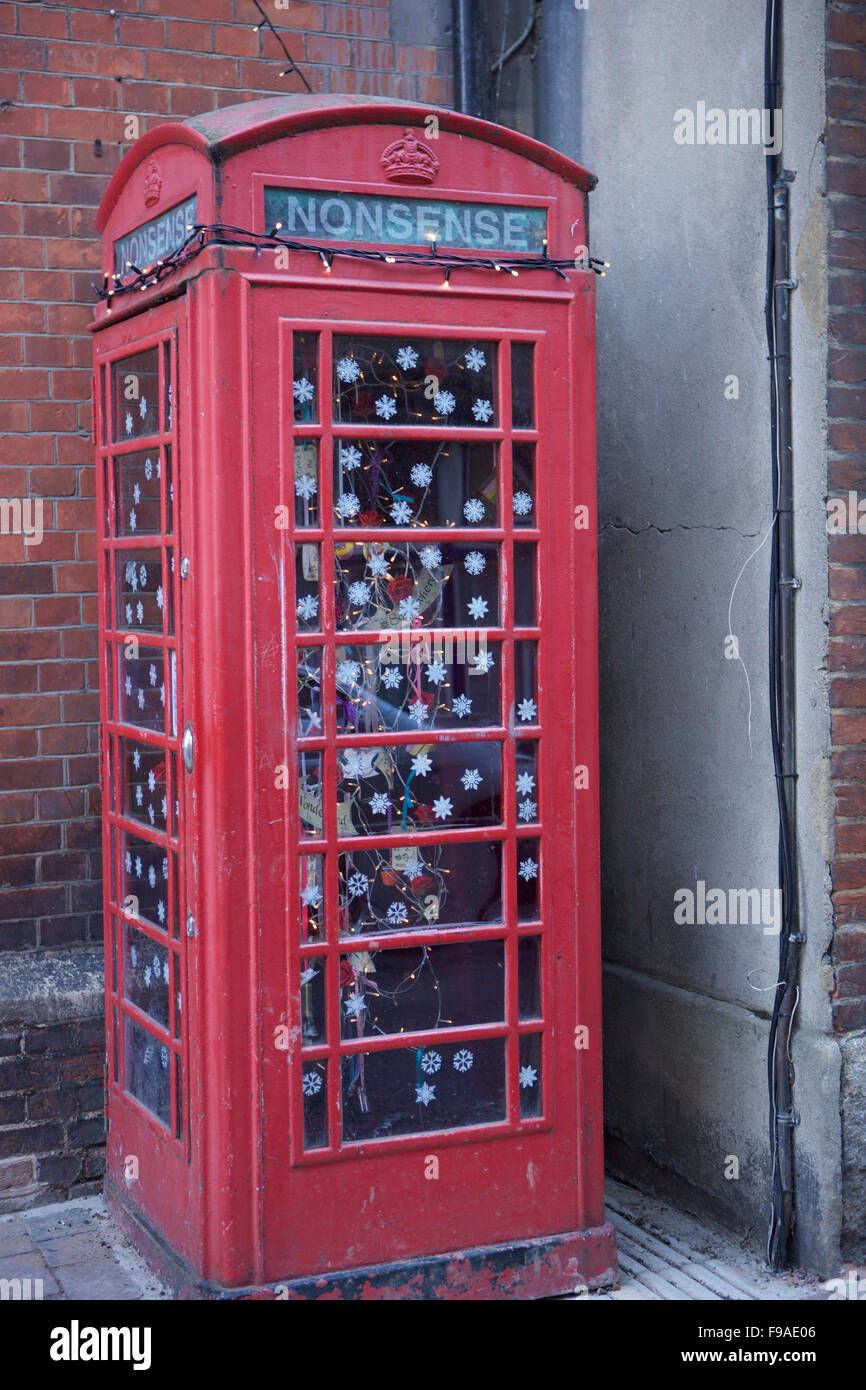 Old red telephone kiosk converted to an attraction called Nonsense at Oxford's Story Museum Stock Photo