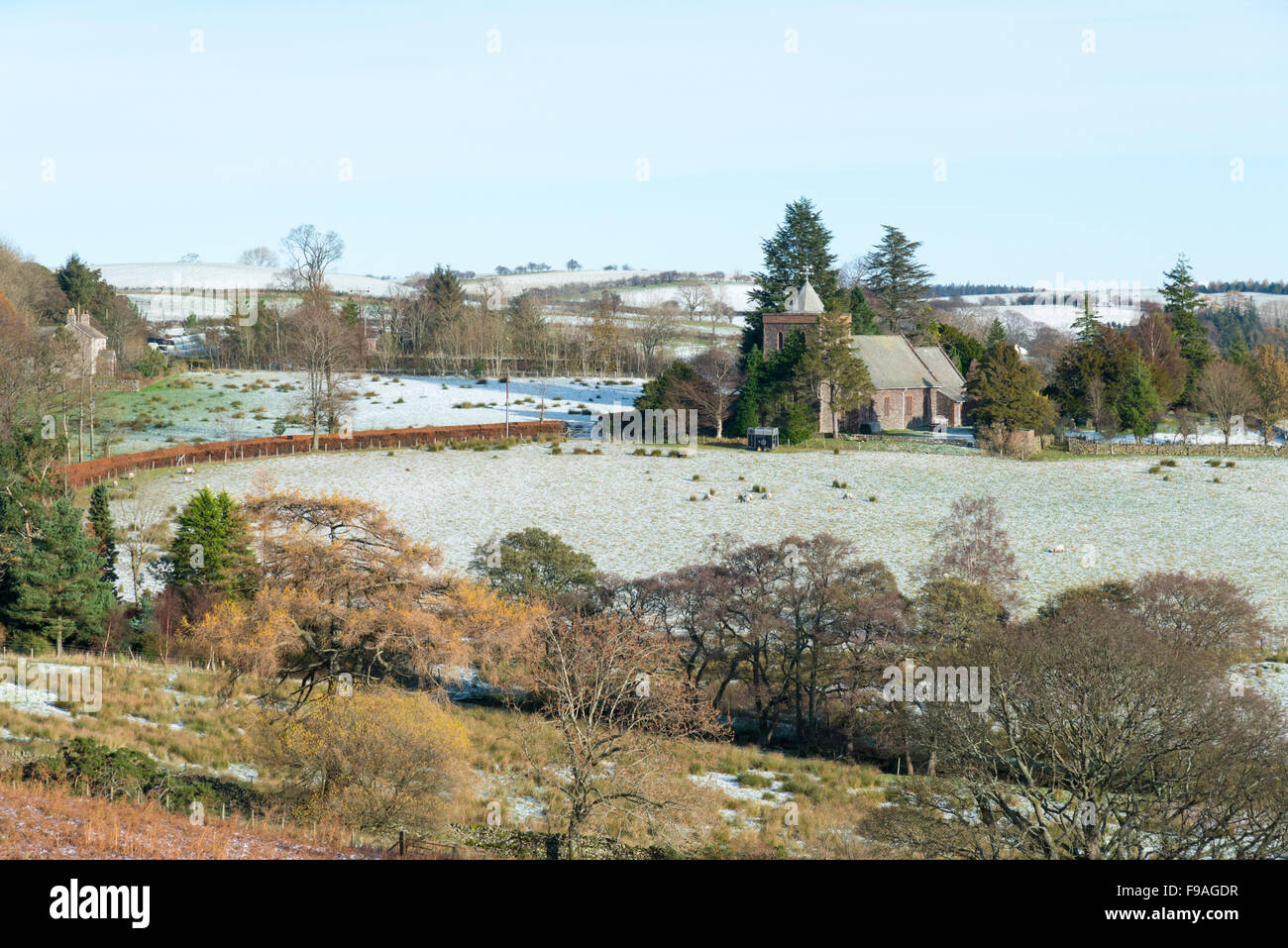 Watermill Lock Watermillock church set in a snowy landscape in the Lake District in ...