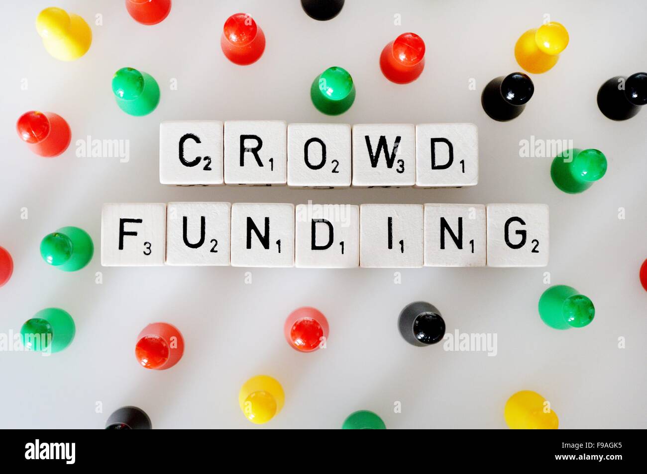 Figures around the word crowdfunding, Germany, city of Osterode, 15. December 2015. Photo: Frank May Stock Photo