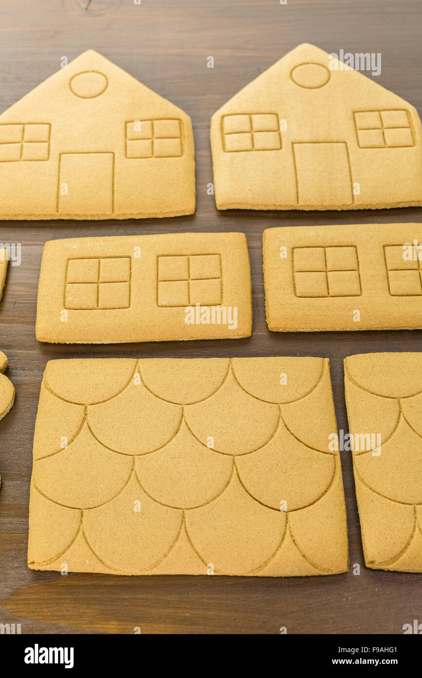 Decorating gingerbread house with royal icing and colorful candies Stock Photo Alamy