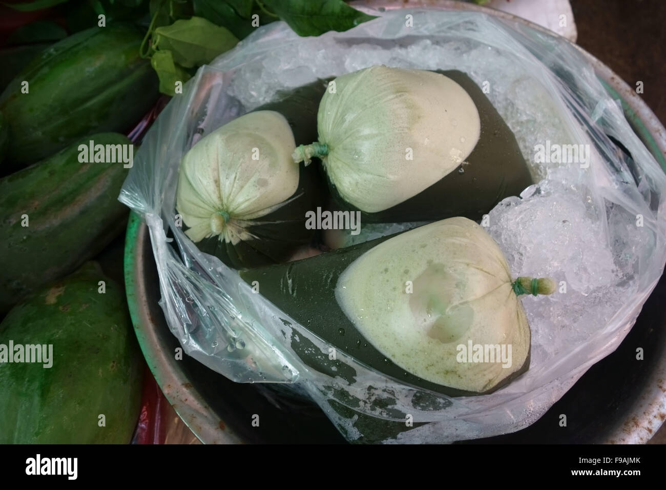 Gotu kola or centella juice for sale in bags on a stall in a Bangkok wet food market, Thailand Stock Photo