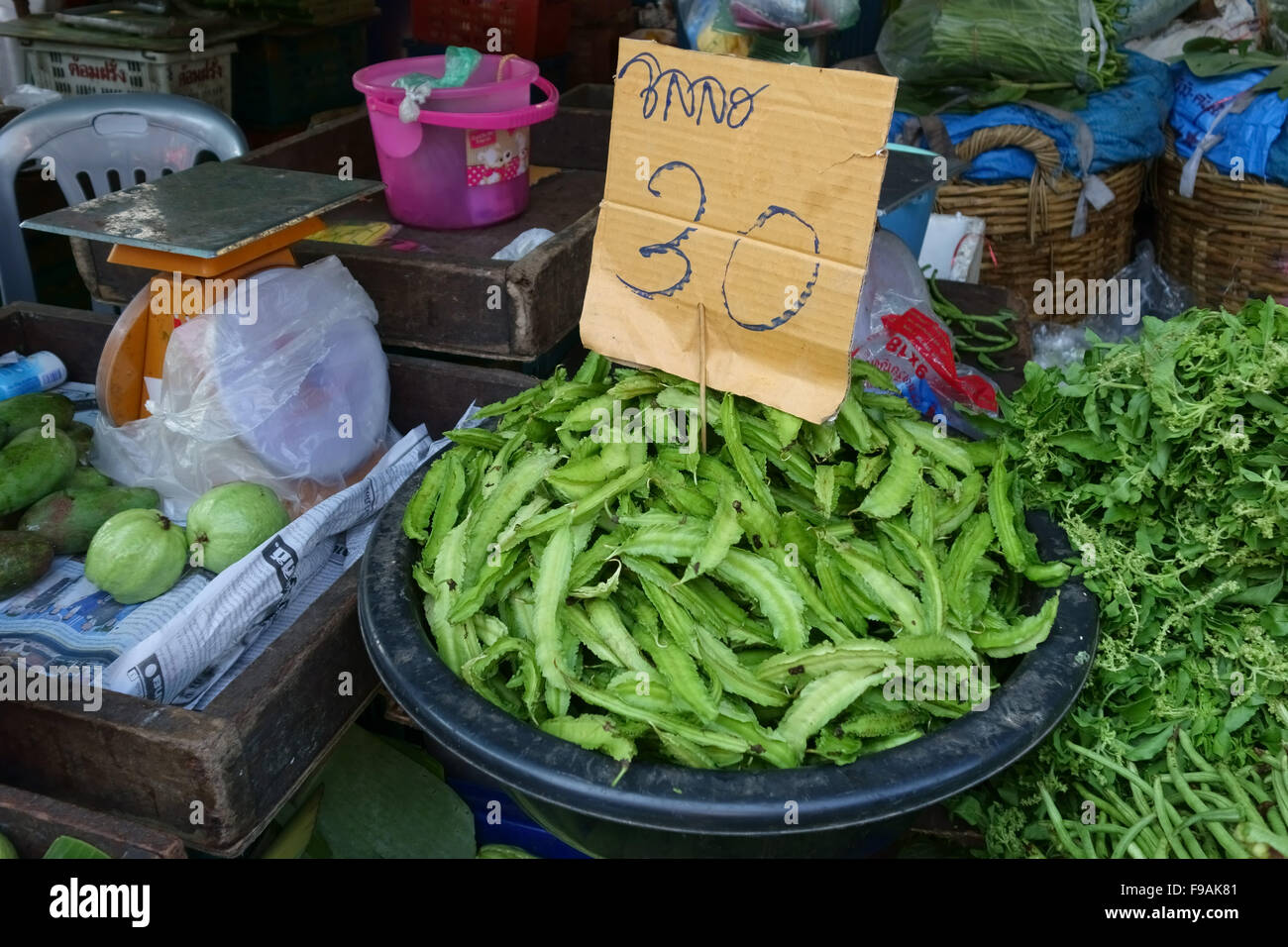 Winged beans for sale in a Bangkok wet food market, Thailand, February Stock Photo